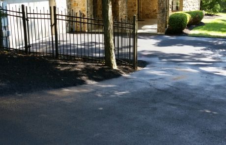 paved driveway at stone house